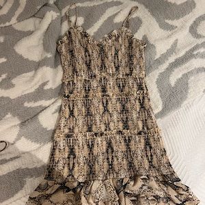 Snake skin print dress, fitted with ruffle detailing.